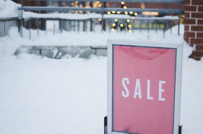 Close-up of sign on snow