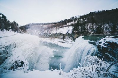 Scenic view of snow covered landscape against sky