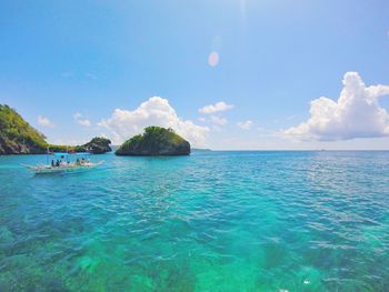 Scenic view of sea against blue sky