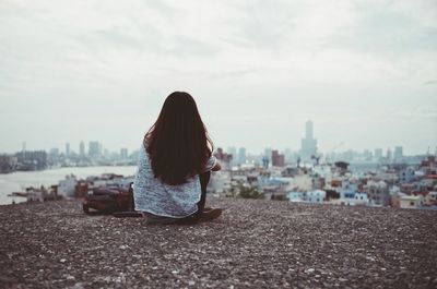 Woman looking at cityscape