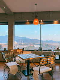 Empty chairs and tables in cafe