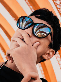 Portrait of young woman wearing sunglasses