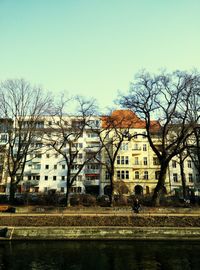 Buildings against clear blue sky