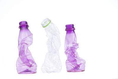 Close-up of bottles against white background