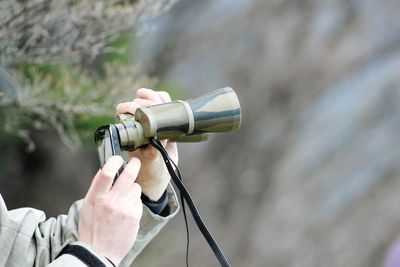 Close-up of hand holding camera