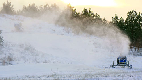 Scenic view of snow covered land