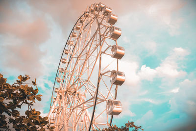 Low angle view of ferris wheel against sky