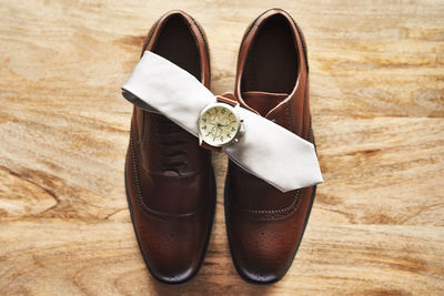 High angle view of shoes on hardwood floor