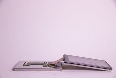 High angle view of piano on table against white background