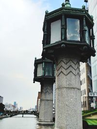 Low angle view of building against cloudy sky