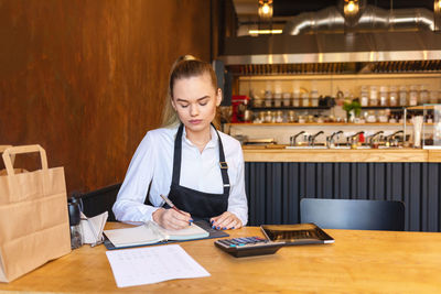 Woman working on table