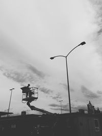 Low angle view of street light against sky