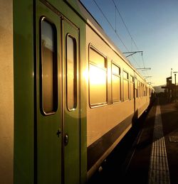 Train at railroad station against sky