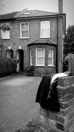 Woman standing by building