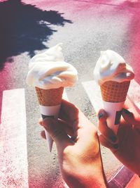 Close-up of hand holding ice cream