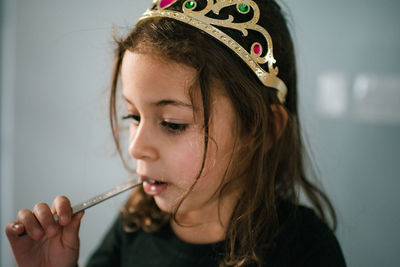 Close-up portrait of a girl looking down