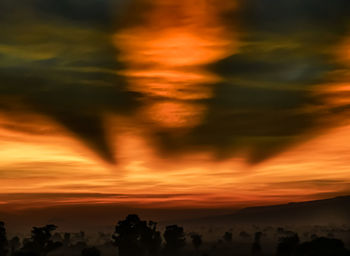 Scenic view of dramatic sky during sunset