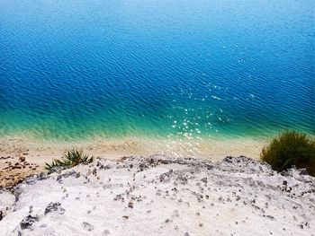 High angle view of beach against blue sky