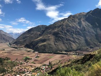 Scenic view of landscape and mountains against sky
