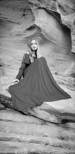 Woman sitting on rock