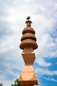 Low angle view of statue against sky