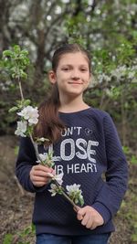 Portrait of cute girl standing outdoors