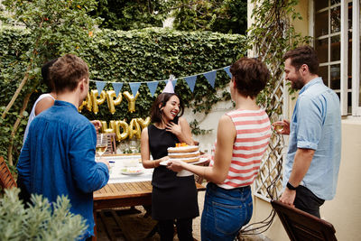 People celebrating birthday outdoors