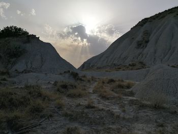 Scenic view of mountains against sky during sunset