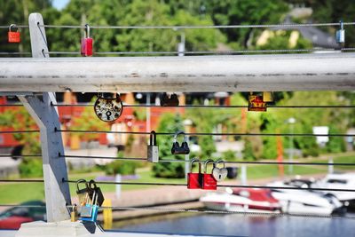 Close-up of water hanging against blurred background