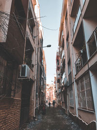 Street amidst buildings against sky