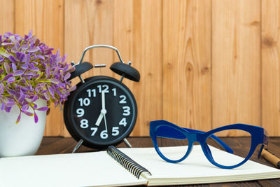 Close-up of clock on table
