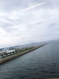 Scenic view of sea against cloudy sky