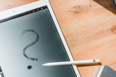 High angle view of smart phone on table