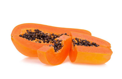 Close-up of papaya against white background