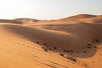 Scenic view of desert against clear sky