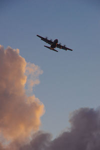 Low angle view of helicopter against sky