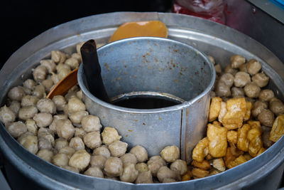 Street food that is sold by way of using a motor that is modified with a pan