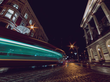 High angle view of light trails on road at night