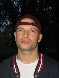 Portrait of young man wearing sunglasses against trees