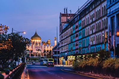 Kuching at dusk - illuminated mosque at the background 