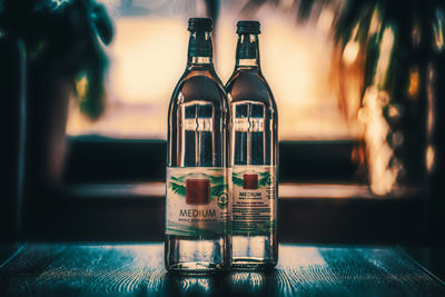 Close-up of glass bottles on table