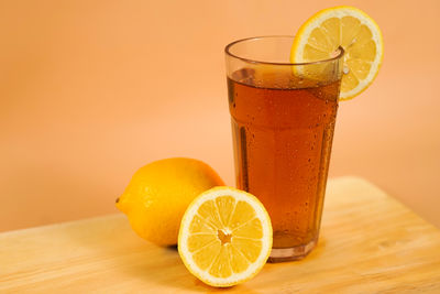 Close-up of orange juice in glass on table