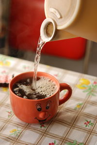 High angle view of coffee cup on table