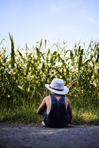 Woman sitting on field