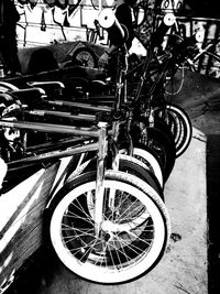 Close-up of bicycle parked against blurred background