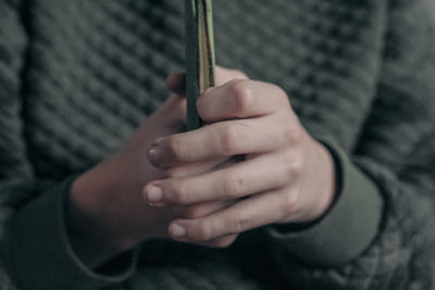 Midsection of woman holding book