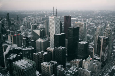 Aerial view of modern buildings in city against sky