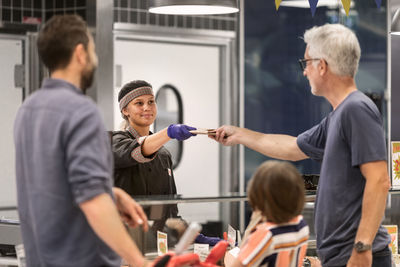 Costumers at deli counter