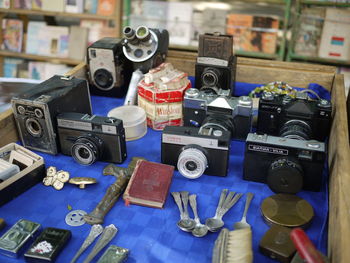 High angle view of old cameras on table in shop