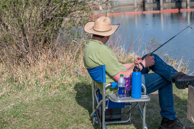 Man sitting on seat in field